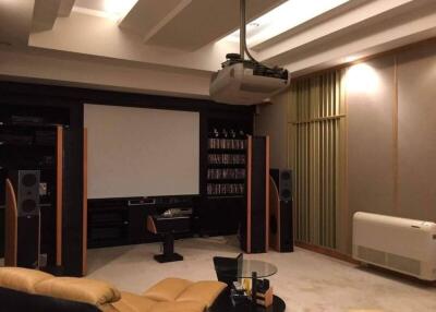 Home theater living room with projector and screen