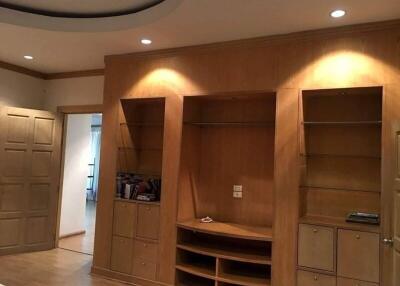 Bedroom with wooden built-in shelves