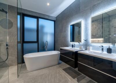 Modern bathroom with bathtub and double sink vanity