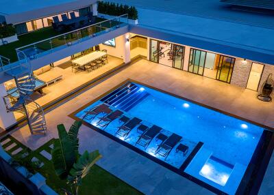 Modern outdoor area with pool and seating