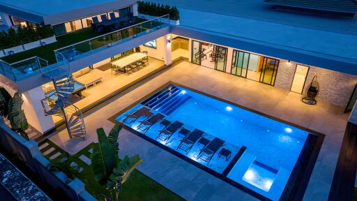 Modern outdoor area with pool and seating