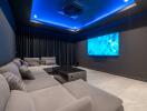 Home theater with gray sectional sofa and blue LED ceiling lights