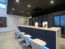 Modern kitchen with a sleek island and bar stools