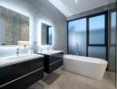 Modern bathroom with twin mirrors and freestanding bathtub