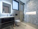 Modern bathroom with glass shower and wall-mounted sink