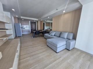 Spacious living area with a modern design and hardwood flooring