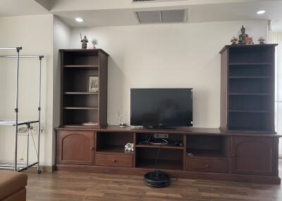 Living room with TV stand and shelving units
