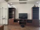 Living room with TV stand and shelving units