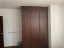 Bedroom with built-in wooden closet