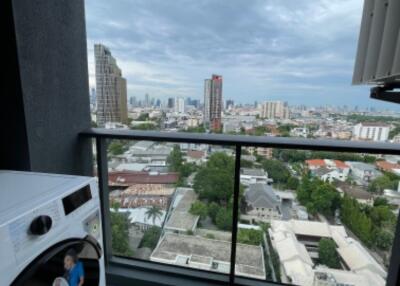 Balcony with city view and washing machine