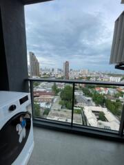 Balcony with city view and washing machine