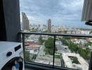 Balcony with city view and washing machine