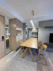 Modern dining area with wooden table and chairs