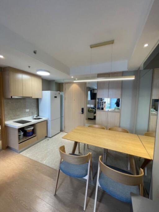 Modern kitchen and dining area with wooden furniture