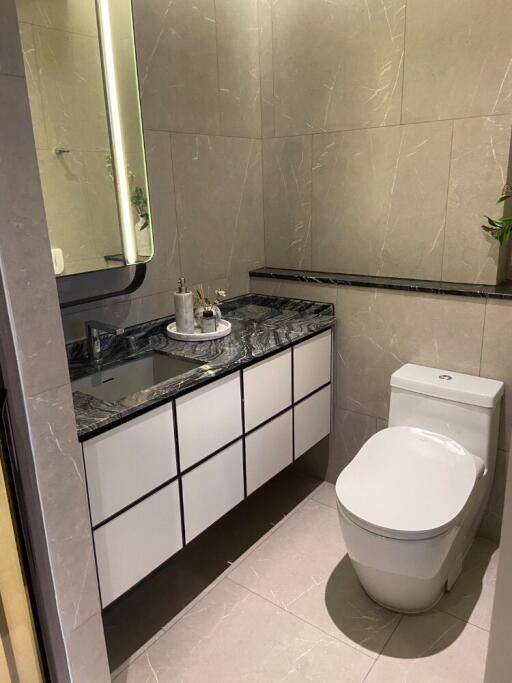 Modern bathroom with sleek fixtures and marble countertop