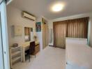 Spacious bedroom with study area and ample storage