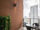 A city view balcony with a table and chairs