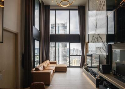 Modern living room with large windows and a city view