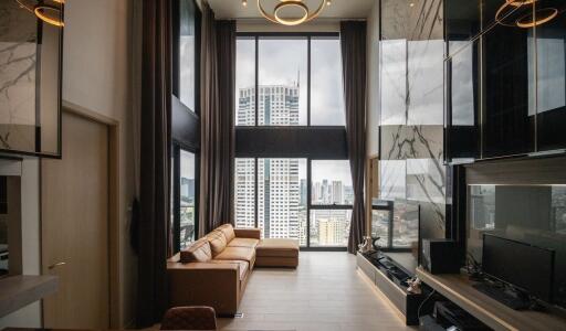 Modern living room with large windows and a city view