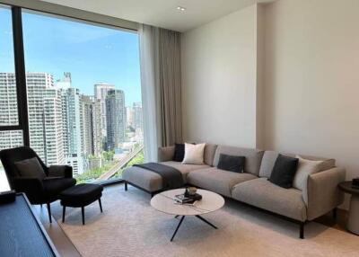 Modern living room with a large window and city view