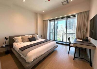 Modern bedroom with large window and city view