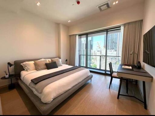 Modern bedroom with large window and city view