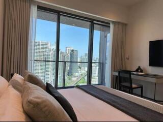 Bedroom with city view and desk area