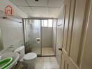 Bathroom with glass shower enclosure and modern fixtures