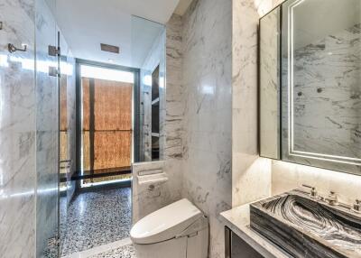 Modern bathroom with marble and tiled features