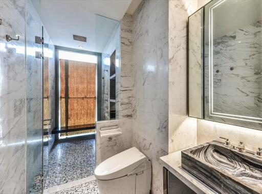 Modern bathroom with marble and tiled features