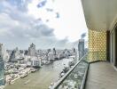 High-rise building balcony with city and river view