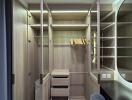 Spacious walk-in closet with open shelves and hanging space