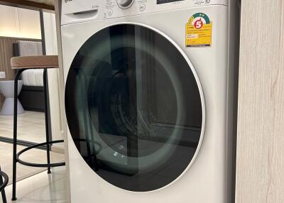 Laundry area with a modern washing machine