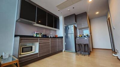 Modern kitchen with wooden cabinets and appliances