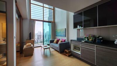 Bright and modern living room with large windows and balcony