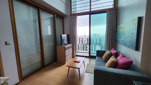 Modern living room with large window and city view