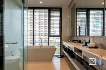 Modern bathroom with large windows and city view