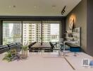 Modern living room with an open kitchen and large windows