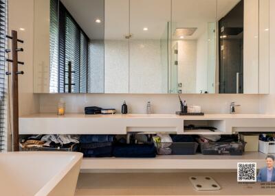 Modern bathroom with large vanity and mirrors