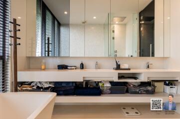 Modern bathroom with large vanity and mirrors