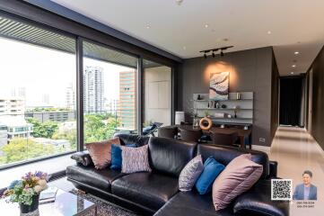 Modern living room with large windows and city view