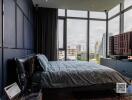 Modern bedroom with large windows and city view