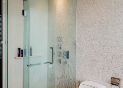 Modern bathroom with a glass shower enclosure and toilet