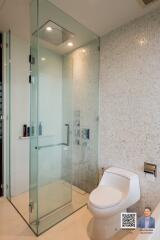 Modern bathroom with a glass shower enclosure and toilet