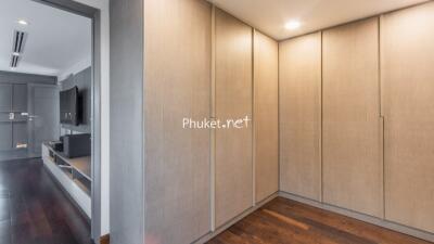 Bedroom with built-in wardrobes and a TV entertainment area