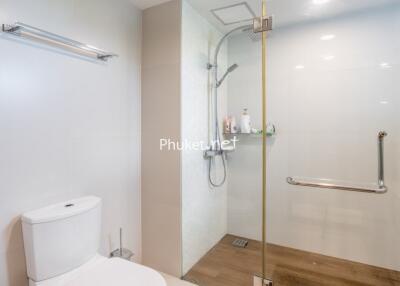 Clean and modern bathroom with glass shower and toilet