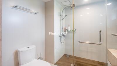 Clean and modern bathroom with glass shower and toilet