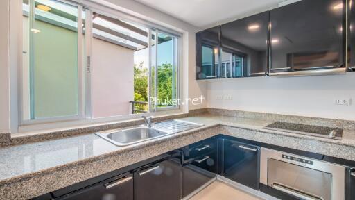 Modern kitchen with granite countertops and stainless steel appliances