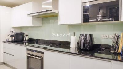 Modern kitchen with appliances and black countertop