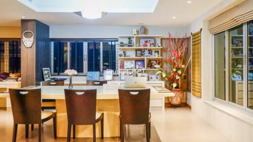 Modern dining room with table, chairs, and decorative shelves